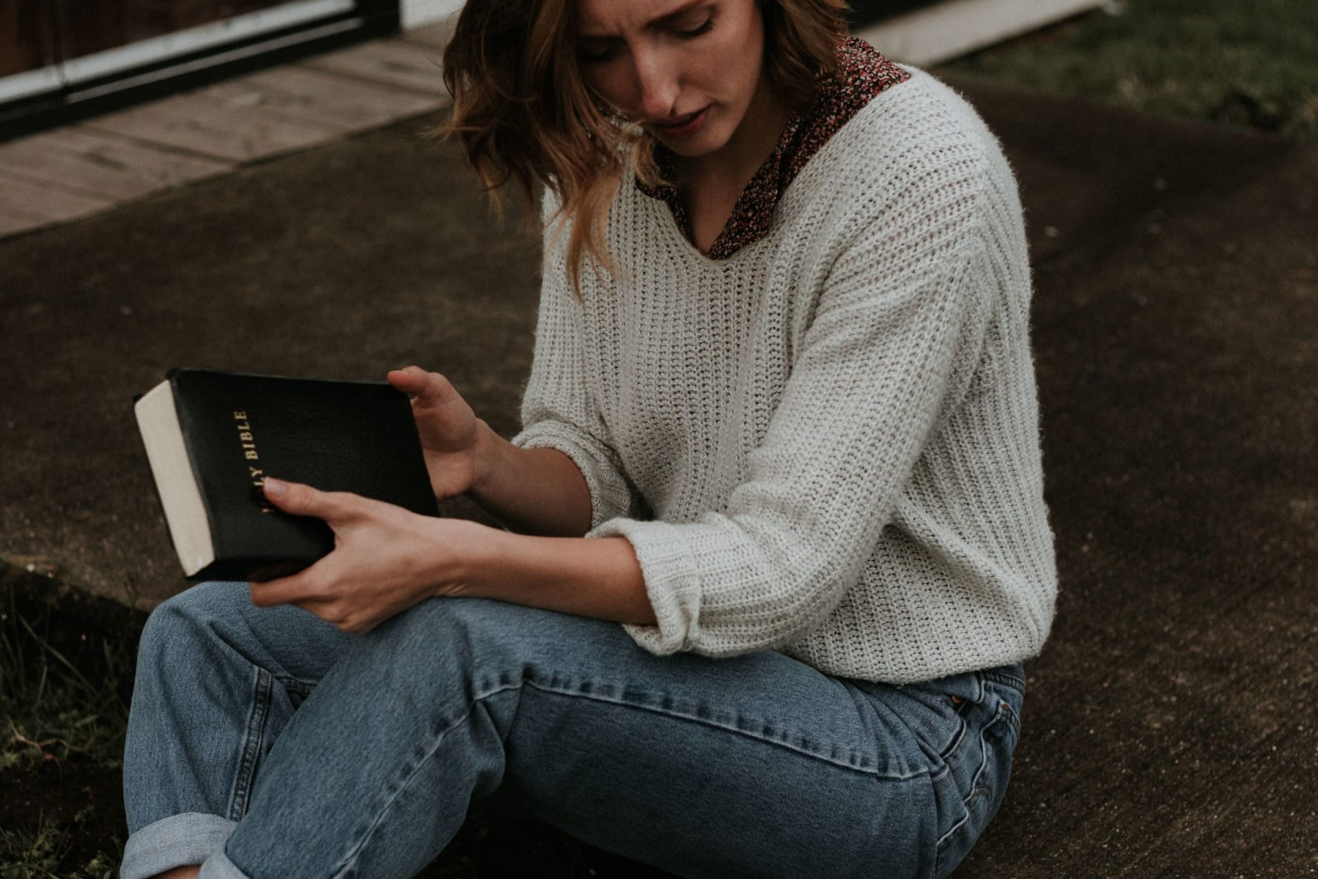 woman sitting with bible