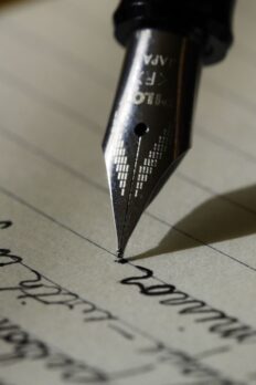 fountain pen nib on paper {{brizy_dc_image_alt entityId=