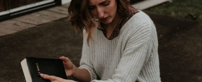 woman sitting with bible